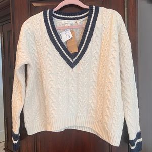 Well, cableknit sweater
